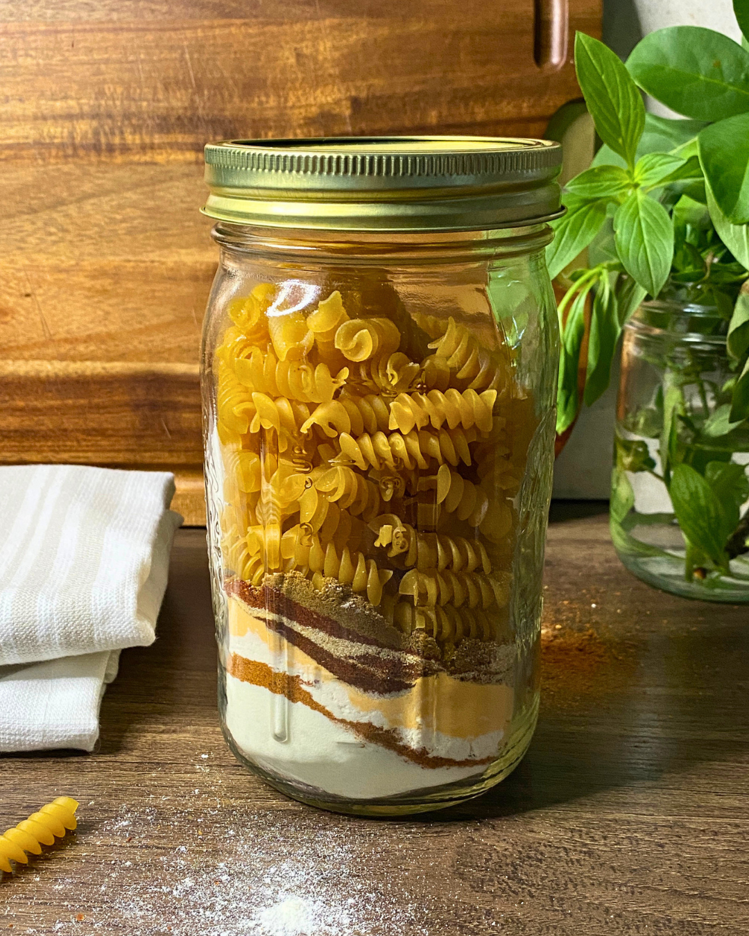 Chili mac meal in a jar with dry pasta and powdered ingredients